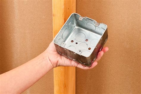 how to remove a knockout from an electrical box|open knockouts on outlet boxes.